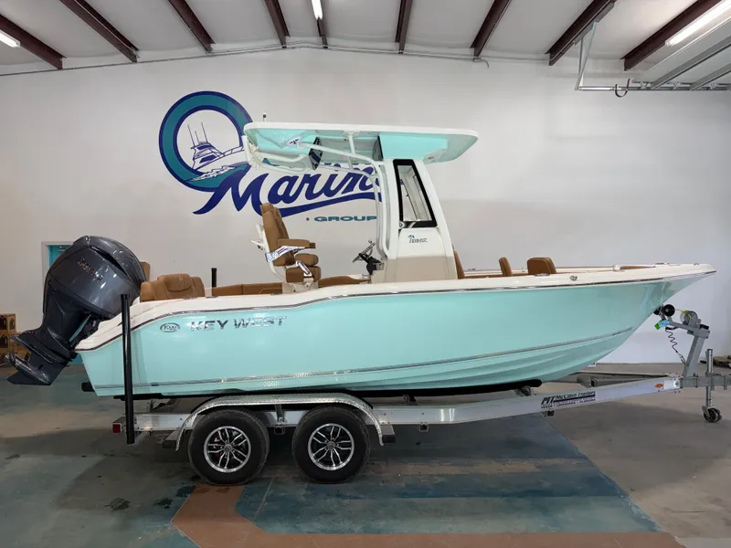 The Image of 2026 Key West 219FSR boat on trailer in warehouse. - 1