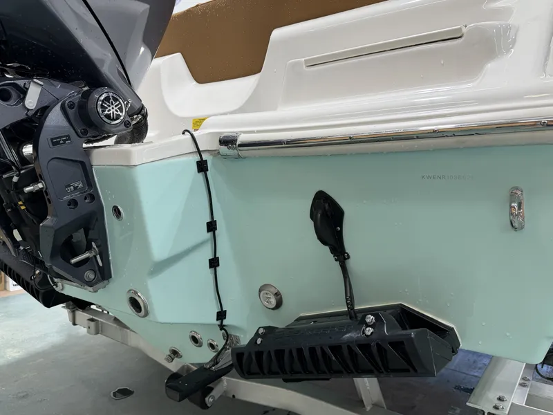 Slide: The Image of Rear view of a 2026 Key West 219FSR boat with outboard motor. - 14