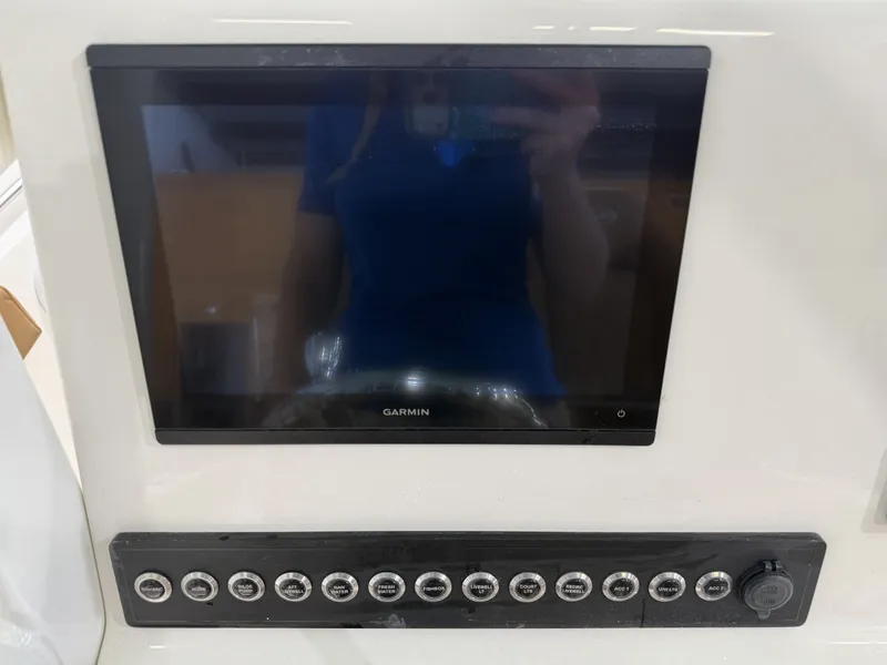 Slide: The Image of Garmin screen and switch panel on Key West 219FSR 2026. - 17