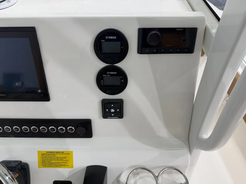 Slide: The Image of Dashboard of Key West 219FSR boat, model year 2026. - 18