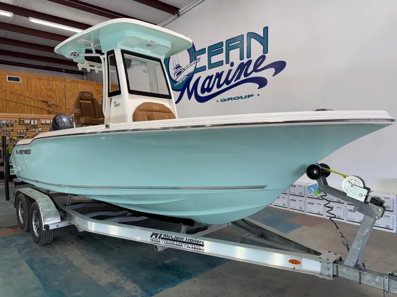 Slide: The Image of Key West 219FSR 2026 boat on trailer in warehouse. - 3