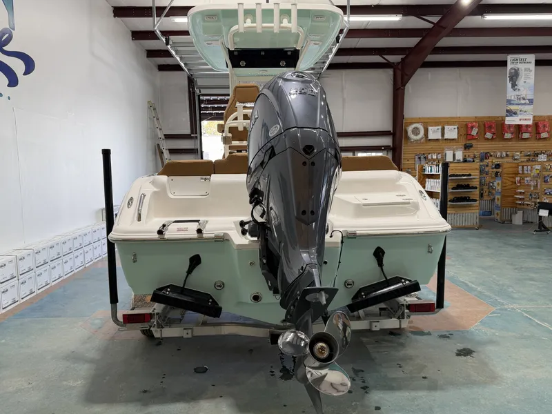Slide: The Image of Key West 219FSR 2026 boat in showroom with outboard motor. - 5
