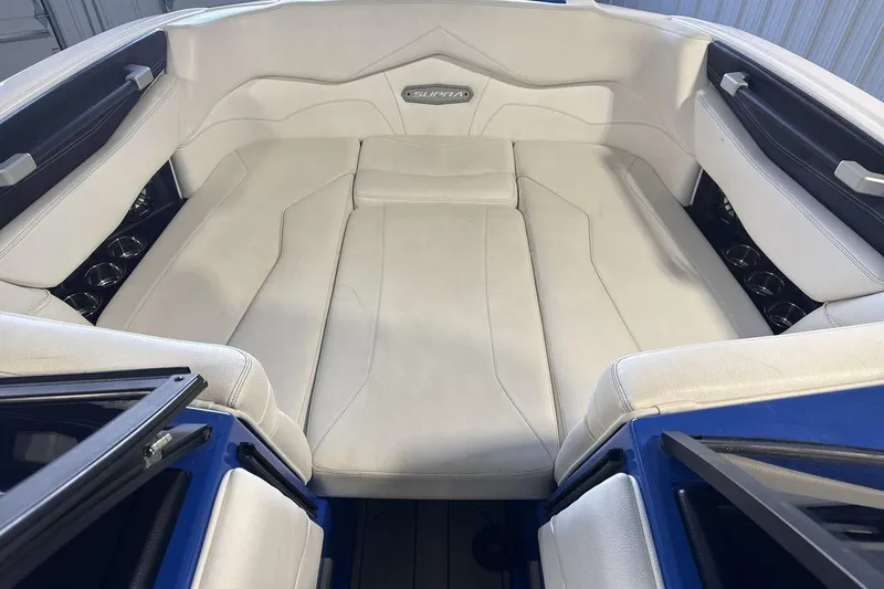 Slide: The Image of 2019 Supra SA 550 boat interior with white cushioned seating and sleek design. - 11