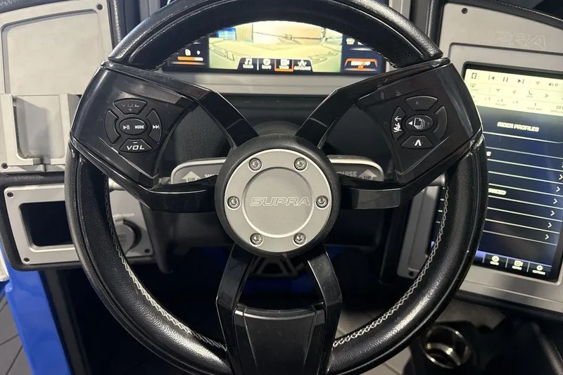 Slide: The Image of Steering wheel of a 2019 Supra SA 550 with integrated controls and dashboard display. - 14