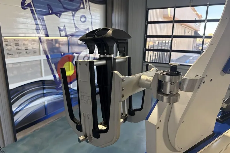 Slide: The Image of Robotic arm in a workshop, featuring a 2019 Supra SA 550 model component. - 22