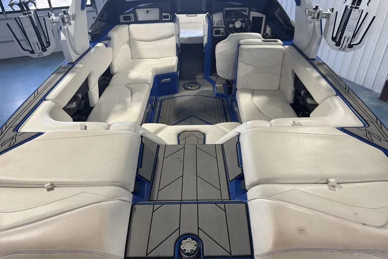 Slide: The Image of 2019 Supra SA 550 boat interior with white leather seating and modern design. - 9