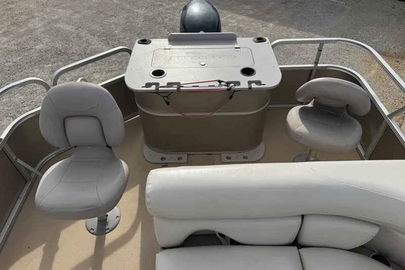 Slide: The Image of 2013 SunChaser 8522 Cruise boat interior with seating and control panel. - 12