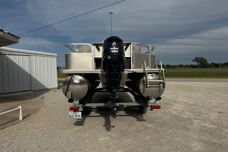 Slide: The Image of 2013 SunChaser 8522 Cruise pontoon boat with Evinrude 150 engine on trailer. - 2
