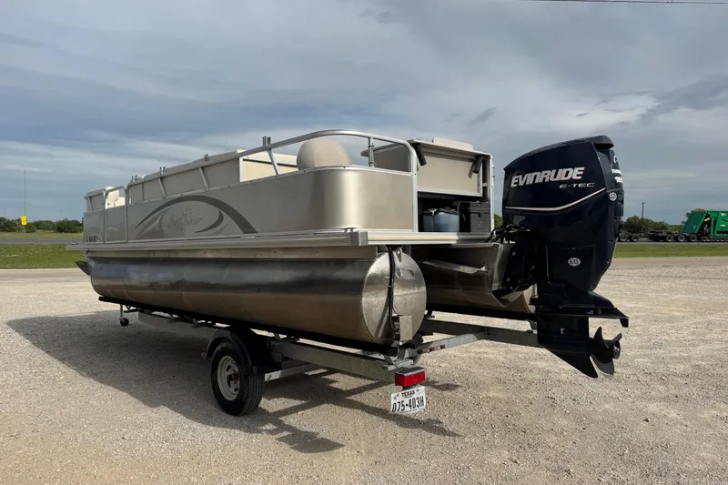 Slide: The Image of 2013 SunChaser 8522 Cruise pontoon boat with Evinrude E-TEC engine on trailer. - 3