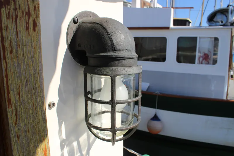 Slide: The Image of Vintage nautical light fixture on a 1972 Fisher 30 boat. - 20