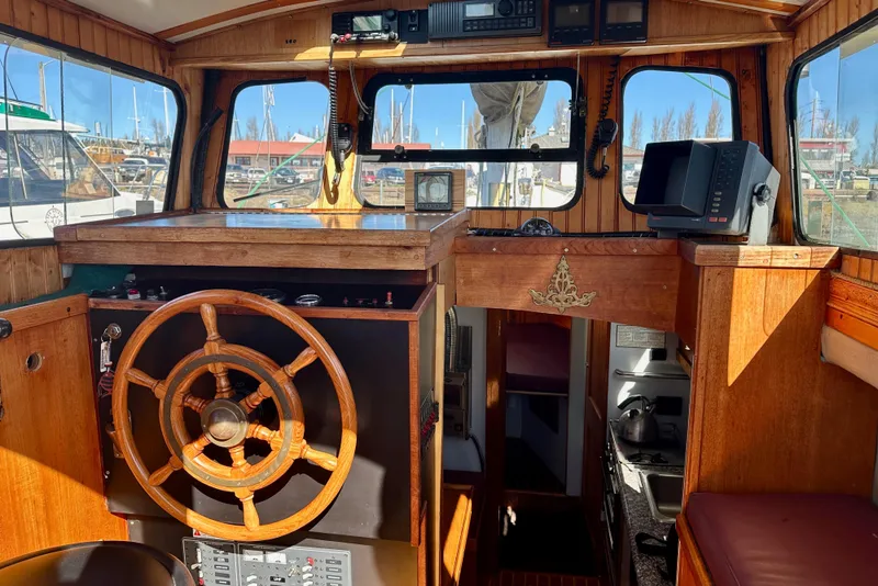 Slide: The Image of Interior of a 1972 Fisher 30 boat with wooden helm and navigation equipment. - 22