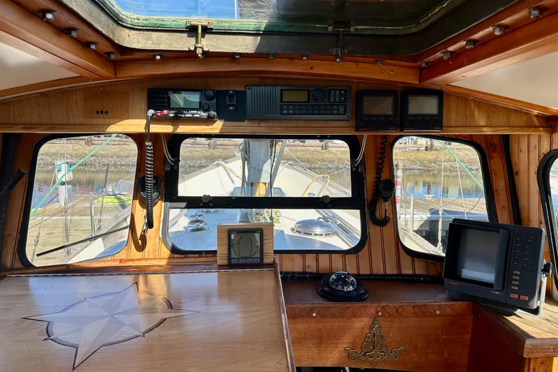 Slide: The Image of Interior view of a 1972 Fisher 30 boat cockpit with navigation equipment. - 24