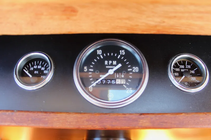 Slide: The Image of 1972 Fisher 30 dashboard gauges displaying RPM, oil pressure, and temperature readings. - 26