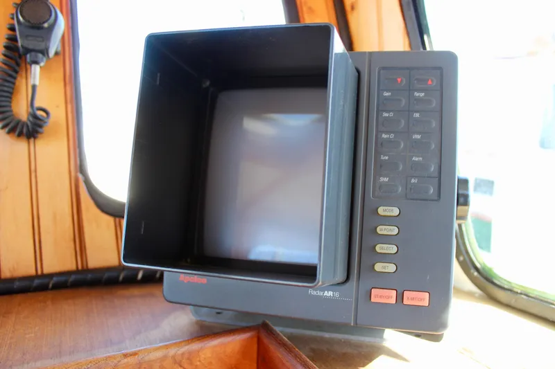Slide: The Image of Vintage radar display on a 1972 Fisher 30 boat, featuring control buttons and screen. - 29