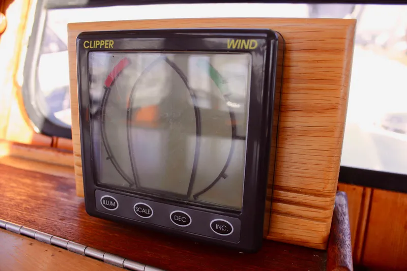 Slide: The Image of Clipper wind instrument on 1972 Fisher 30 boat dashboard, displaying wind direction. - 32