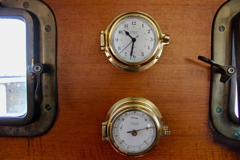 Slide: The Image of Vintage Fisher 30 yacht interior with brass clock and barometer, 1972 model. - 38