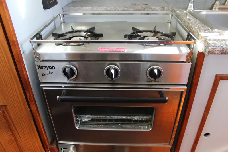 Slide: The Image of Kenyon Kenstar stove and oven in a 1972 Fisher 30 boat kitchen. - 46