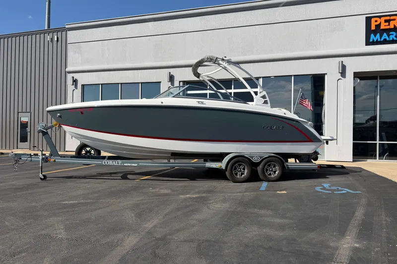 Slide: The Image of 2019 Cobalt R5 boat on trailer outside dealership, showcasing sleek design and modern features. - 1