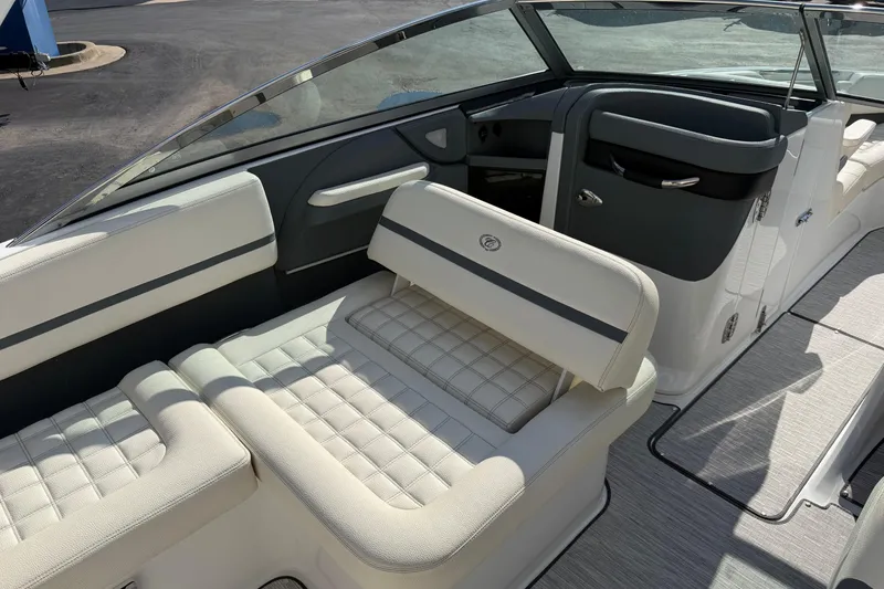 Slide: The Image of 2019 Cobalt R5 boat interior with luxurious white seating and sleek design. - 16