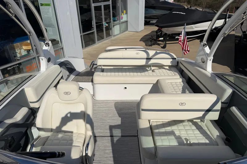 Slide: The Image of 2019 Cobalt R5 boat interior with white seating and American flag. - 18