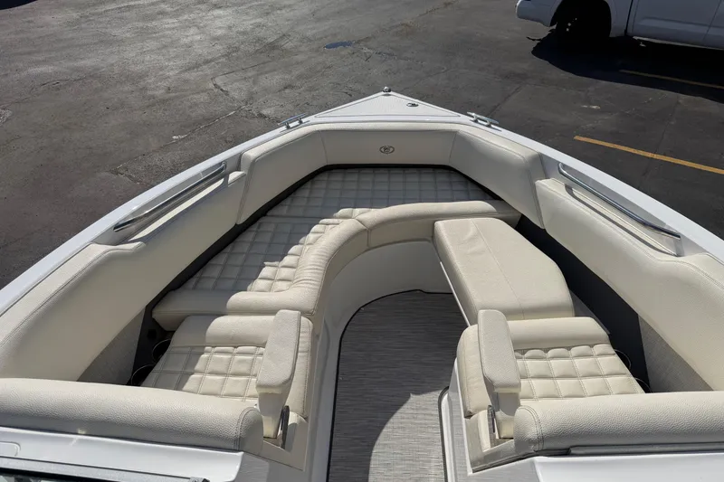 Slide: The Image of 2019 Cobalt R5 boat interior with luxurious white seating and spacious layout. - 19