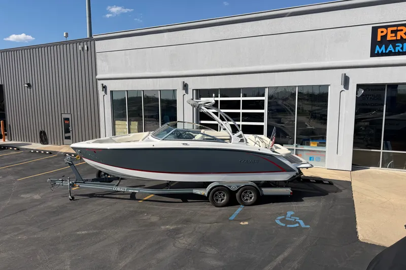 Slide: The Image of 2019 Cobalt R5 boat on trailer outside dealership, sunny day. - 2