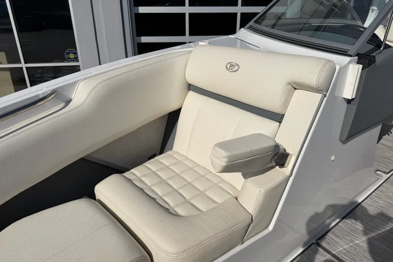 Slide: The Image of Luxurious seating in a 2019 Cobalt R5 boat, featuring elegant white upholstery and armrest. - 21