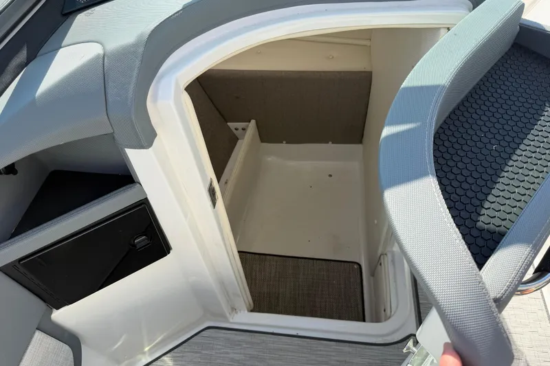 Slide: The Image of Interior of a 2019 Cobalt R5 boat with storage space. - 22