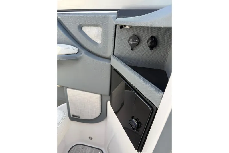 Slide: The Image of Interior detail of a 2019 Cobalt R5 boat, featuring sleek design and storage compartment. - 23