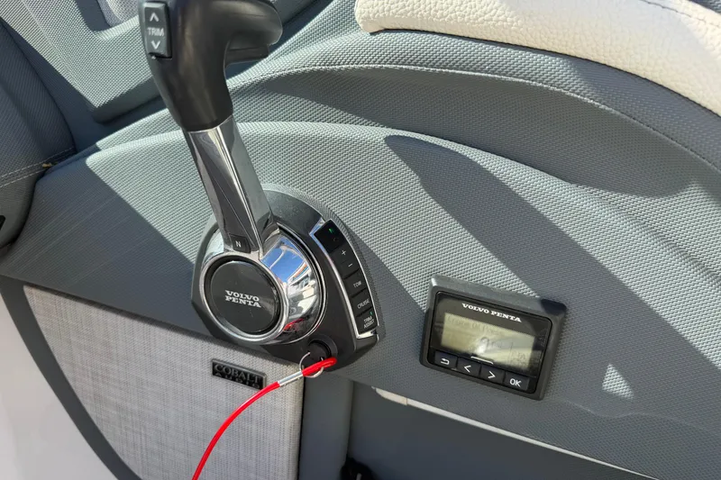 Slide: The Image of Close-up of 2019 Cobalt R5 boat controls featuring Volvo Penta throttle and display. - 25