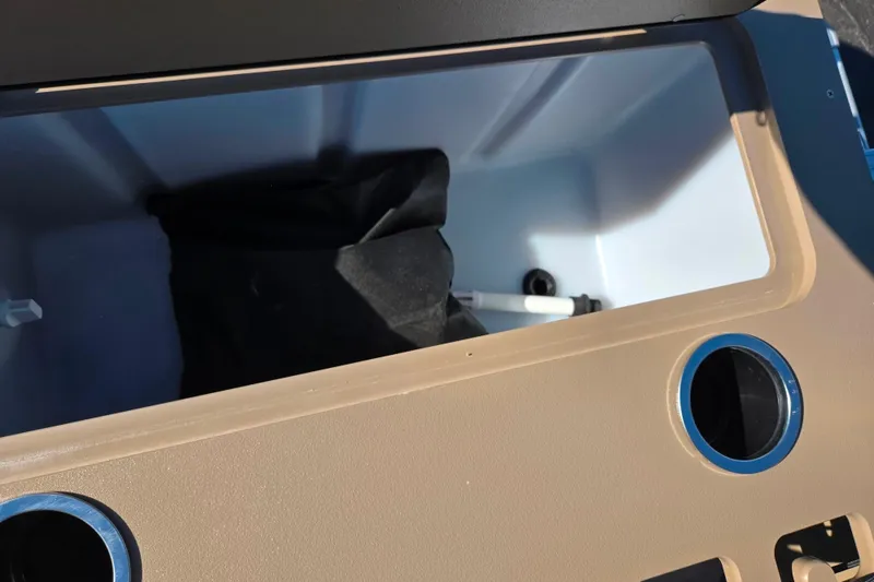 Slide: The Image of Storage compartment in 2023 SunChaser Geneva Fish 22 boat, featuring beige interior. - 19