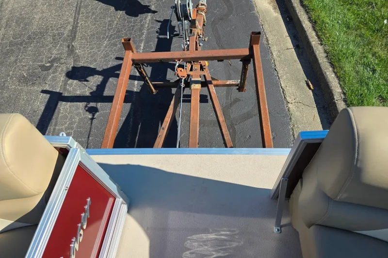 Slide: The Image of 2023 SunChaser Geneva Fish 22 boat interior with trailer view. - 26