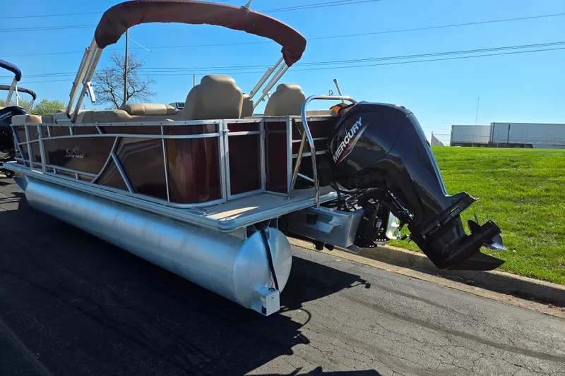 Slide: The Image of 2023 SunChaser Geneva Fish 22 pontoon boat with Mercury outboard motor on a sunny day. - 3