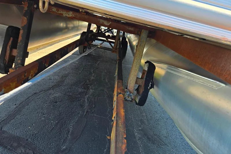 Slide: The Image of Underside view of 2023 SunChaser Geneva Fish 22 pontoon boat on trailer. - 7