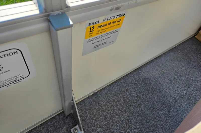 Slide: The Image of 2016 Sun Tracker Party Barge 24 DLX capacity label, indicating 12 persons or 1685 lbs. - 15