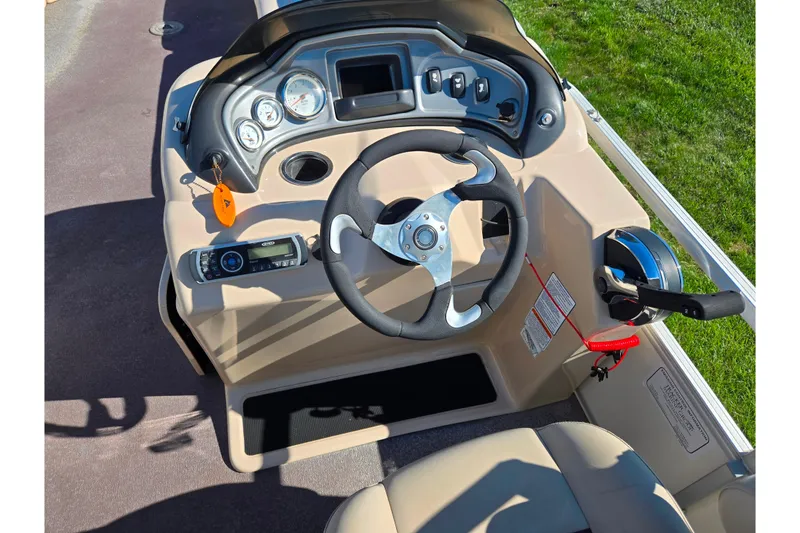 Slide: The Image of Steering console of 2016 Sun Tracker Party Barge 24 DLX pontoon boat. - 21