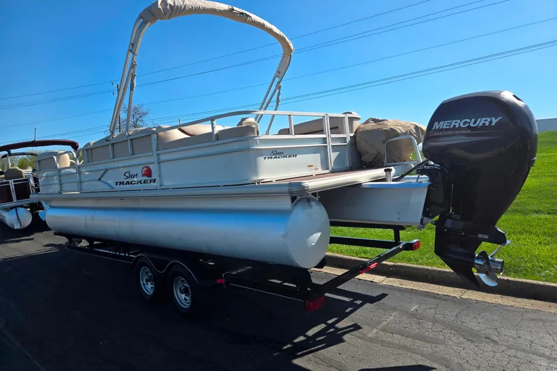 Slide: The Image of 2016 Sun Tracker Party Barge 24 DLX pontoon boat with Mercury outboard motor on trailer. - 3