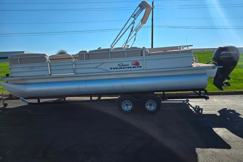 Slide: The Image of 2016 Sun Tracker Party Barge 24 DLX pontoon boat on trailer, side view. - 4