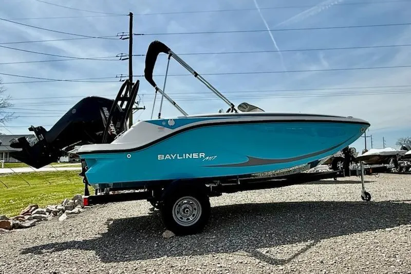 The Image of 2026 Bayliner M17 boat on trailer, blue, side view. - 1