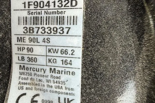 Slide: The Image of Mercury Marine engine label with serial number and power specifications. - 14