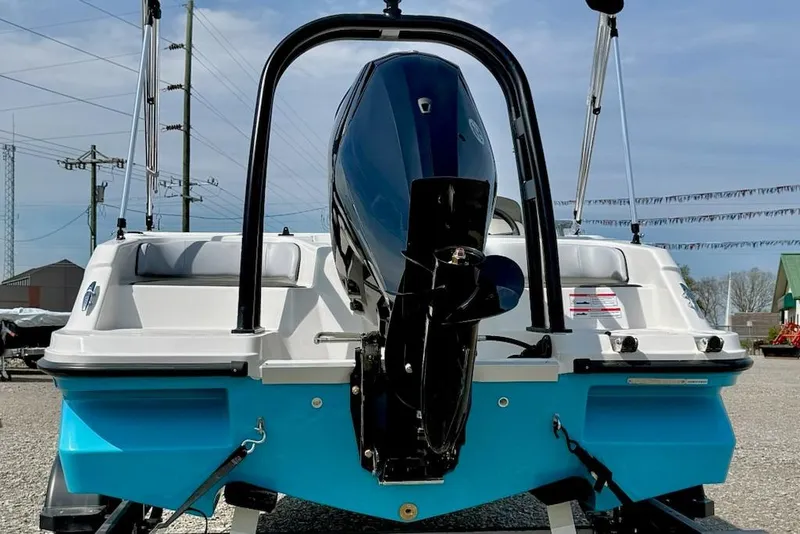 Slide: The Image of Rear view of 2026 Bayliner M17 boat with outboard motor. - 3