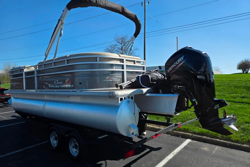 Slide: The Image of 2024 Sun Tracker Party Barge 20 DLX pontoon boat with Mercury outboard motor. - 3