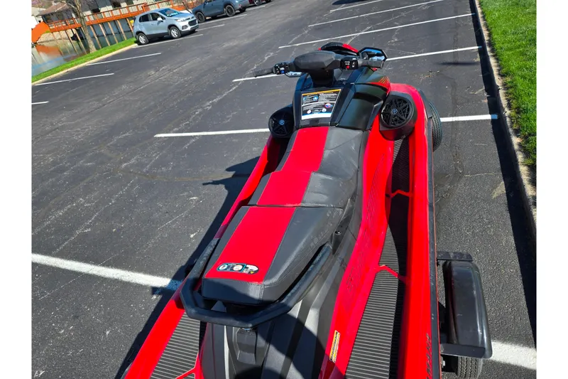 Slide: The Image of 2025 Yamaha WaveRunner VX Deluxe in a parking lot, showcasing sleek red design. - 10