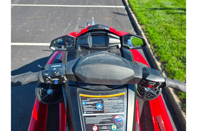 Slide: The Image of 2025 Yamaha WaveRunner VX Deluxe dashboard and controls, parked on pavement. - 12