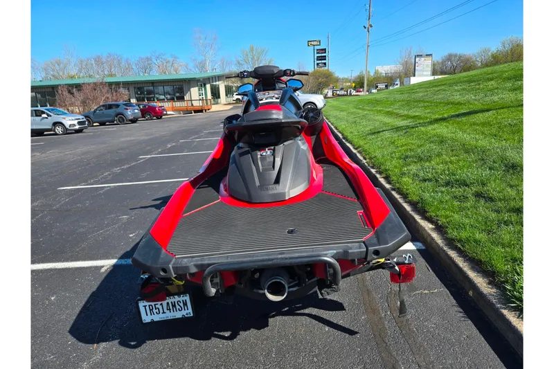 Slide: The Image of 2025 Yamaha WaveRunner VX Deluxe parked in a lot, showcasing sleek design and vibrant colors. - 2
