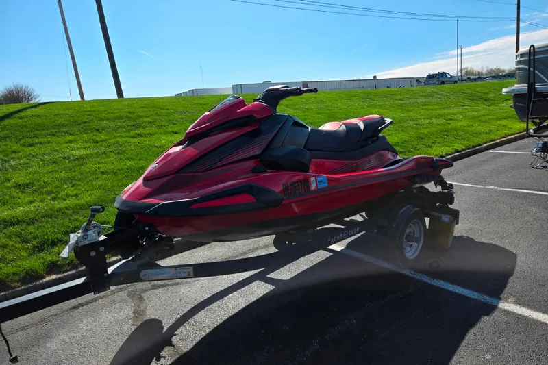 Slide: The Image of 2025 Yamaha WaveRunner VX Deluxe in red, parked on a trailer in a sunny outdoor setting. - 5