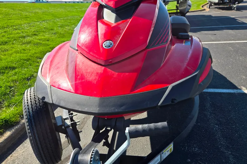 Slide: The Image of Red 2025 Yamaha WaveRunner VX Deluxe on trailer in parking lot. - 6