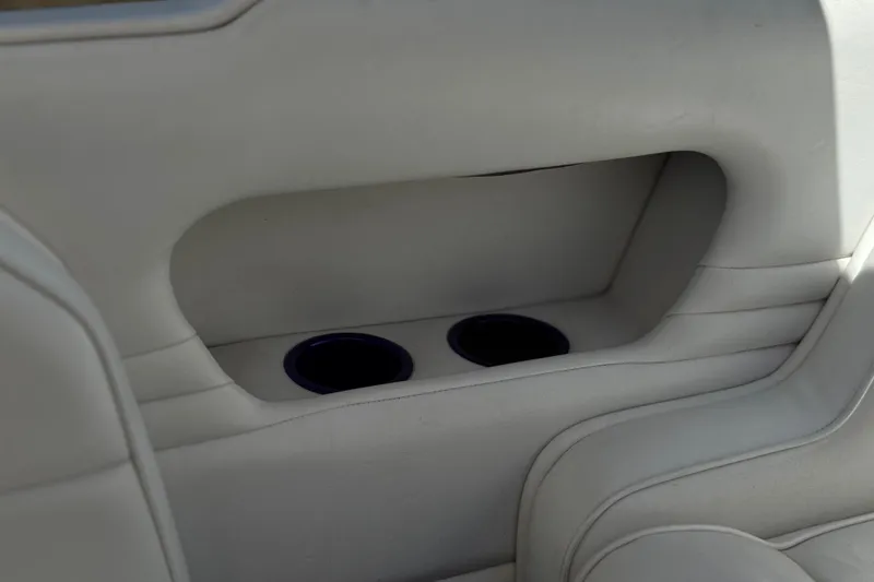 Slide: The Image of Interior of 1996 Warlock Ultimate with built-in cup holders in light upholstery. - 20