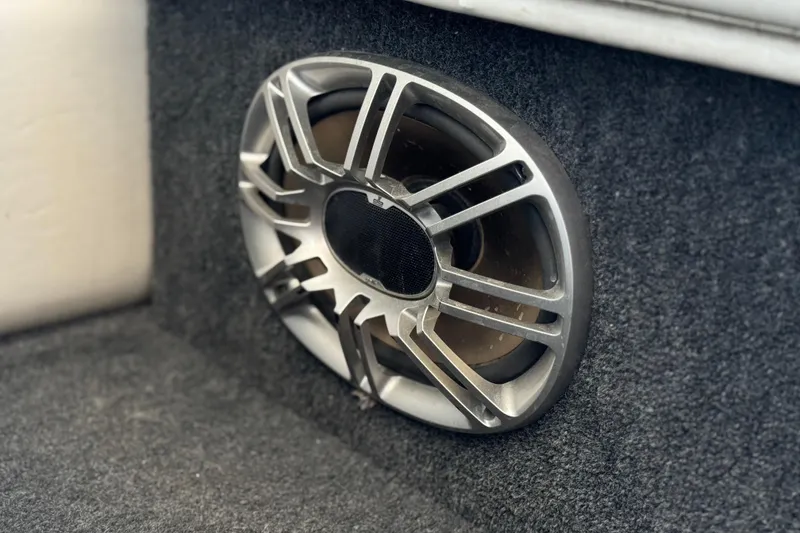 Slide: The Image of Car subwoofer with metallic grille in a carpeted enclosure, Warlock Ultimate 1996 model. - 21