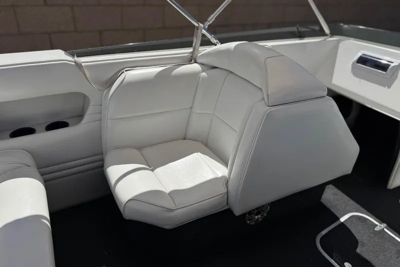 Slide: The Image of White leather seating in a 1996 Warlock Ultimate boat interior. - 22